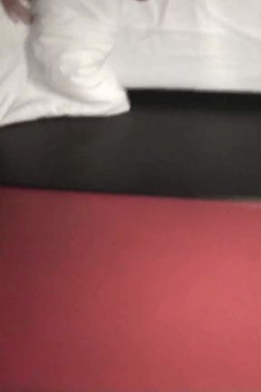 Feet pushing on masked slave