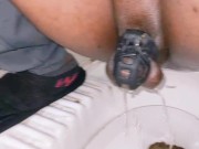 Small penis pissing thought chastity cage and finger ass hole