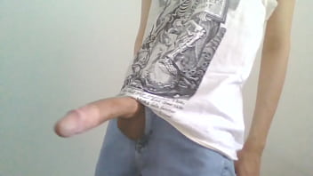 Slim man masturbating in blue jeans