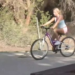 Inked blonde muff diver seduces the wandering cyclist into using a double ended dildo