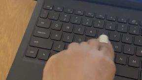 Foot typing on laptop