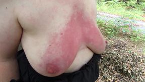 Oil breasts and then beat them red outdoor