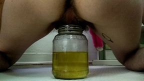 hairy babe pisses in jar, dunks dildo for nasty fun