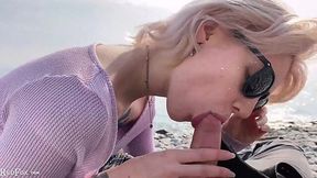 Blonde sucks big cock and swallows by the sea - outdoor fun!