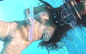 Hot teen Diana in fishnet stockings underwater