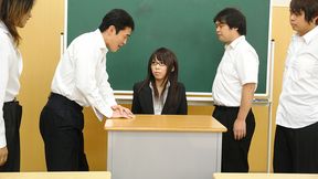 Sexy and arousing dark haired teacher Maho Sawai with glasses gets her black suit taken off and her hairy natural slit rammed pretty hard by a group of her turned on students after the class is over in a nasty group sex session on the desk and moans