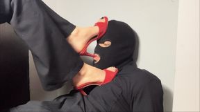 Goddess adri plays with her foot fetish slave under her red high heels sandals