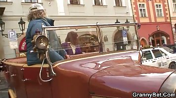 Red haired granny has hooked up with a younger guy and fucked him in her hotel room