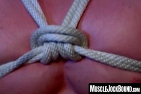 BDSM whipping session for an incredibly buff hunk in a dark and erotic dungeon