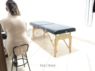 Proctologist performs anal exam on constipated patient.