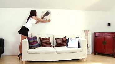 With her black penny loafers and knee socks down around her ankles, this Asian beauty...