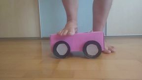 Crushing a tiny woman and her car (toys)