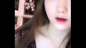 Chinese cam girl pleasures herself on webcam