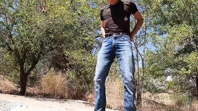 Handsome amateur stud in jeans goes outdoors to stroke his cock