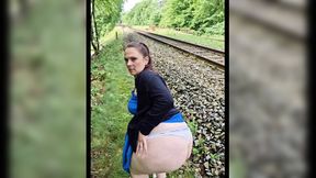 German MILF fucks her pregnant self outside in the field