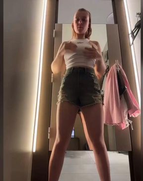 changing room in shopping mall, try different clothes with vibe inside