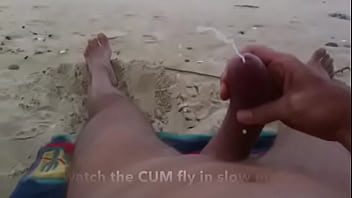 Curved cock wank and cum at nude beach