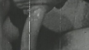 ”Ebony & white vintage video of lady sucking her lover”