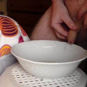 John is peeing into a porcelain bowl