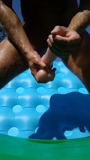 Playing with a big dildo