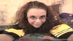 Curly nerdy amateur whore has a glass dildo to pet her own pussy