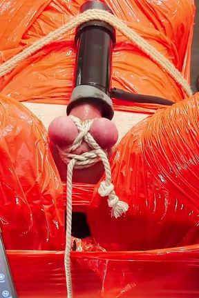 Merciless Cock Milking (tight Shiny Red Plastic Mummificaton and Remote Anal Stimulation)