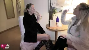 Two beautiful blondes in boots and fur coats