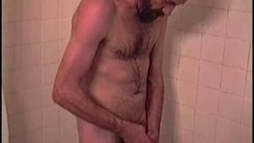 After staying the night and fucking me, I asked my friend Henry if I could film him in the bath tub shooting another load. He said sure, so here it is.