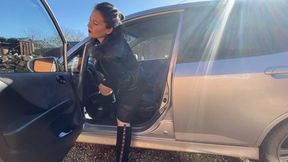lady in black suede boots pedal pumping and smoking in the car aV