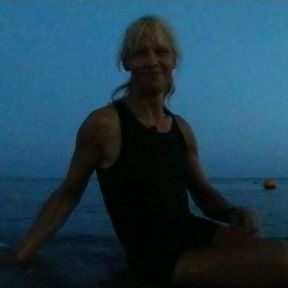 Alexa Cosmic swimming in the sea after sunset in clothes. Wetlook in sneakers, shorts and t-shirt