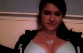 Appealing camgirl shows her tits and then rubs her pretty pussy