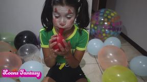 Akina blowing balloons on a space hopper part 2