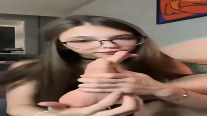 Little Teenage Brunette Nerd Gently Licking Her Toes In Front Of The C