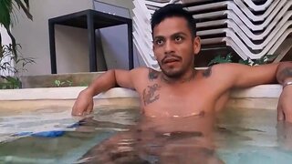 Tattooed Latino with a nice torso relaxing in the pool