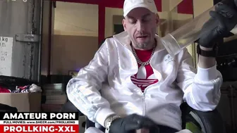 Bear pumps his big uncut cock in sportswear and sneakers