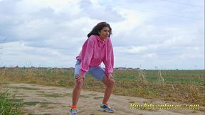 Wetting her jeans outdoor - Desperate hipster girl trying hard to pee - Pee next to the wheel of the car