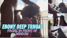ebony deep throat and facial in front of window