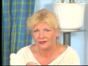 Blonde gilf wearing stockings while dildoing pussy