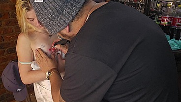 Blonde babe gets tattoo on her nipple