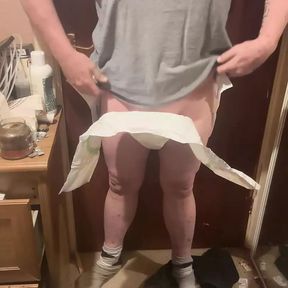 Showing off a tinimals nappie diaper