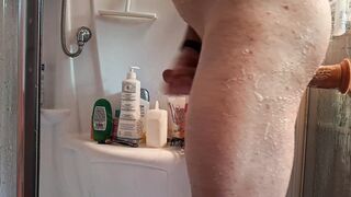Heating up my pucker in the douche with a immense faux-cock