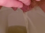 Close up hairy pussy piss and rub on toilet