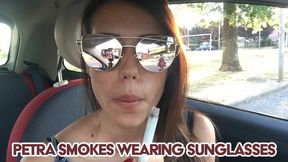 Petra smokes wearing sunglasses - FULLHD