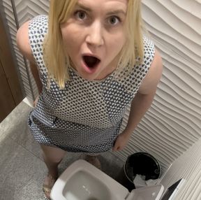 She saw that she was being filmed by a camera in the toilet