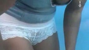 Tanned cutie with small tits changes her underwear in beach cabin