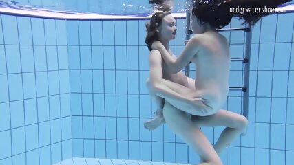 Enjoy a redhead underwater and lesbians