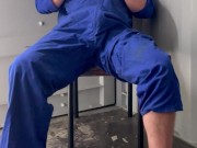 Farm boy in overalls plays at work