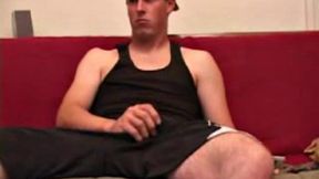 Maxx Wood works his cock under his shorts and then pulls it out to lube up. The man strokes with determination, edging himself a few times, before covering his naked body in a splattering of warm cum.