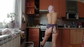 A Sexy Naked Woman Prepares Food in the Kitchen