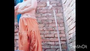 She is massaging her sexy' hot boobs, bathing, naked, and changing clothes.